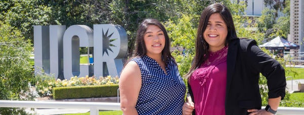 Staff members of UCR's TRIO Scholars program smile for a photo. 